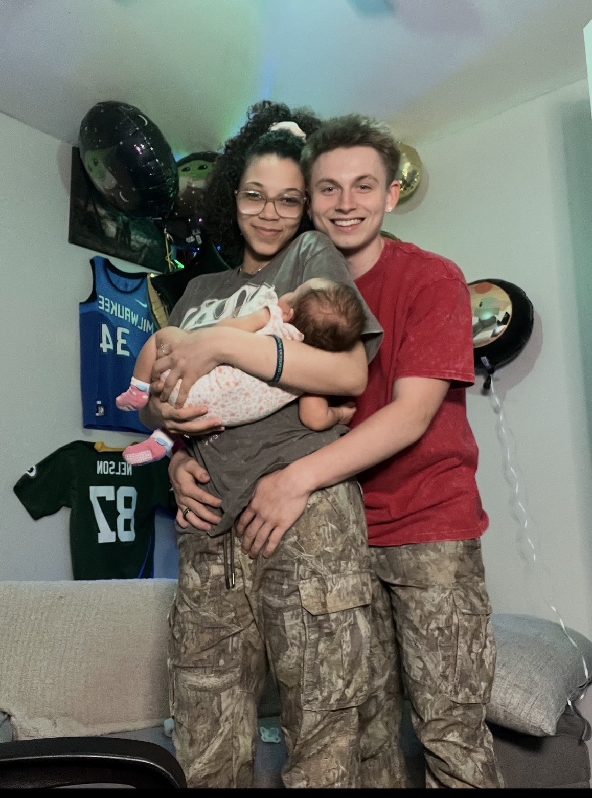 Brandyn with his wife and baby — the family behind Clarksville Shine